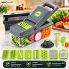 A 16-in-1 multi-functional kitchen mandoline and chopper set by NHC MART, shown with its various interchangeable blades, a peeler, a citrus zester, and a black plastic basket on a kitchen countertop with fresh vegetables.