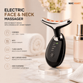 An electric face and neck massager device with a curved black and silver head, standing on a clear acrylic stand on a marble countertop. The image includes promotional text highlighting features like EMS LED beauty device, 3 modes, 45°C warm therapy, 7 LED lights, and 160° curved head, alongside cosmetic props and a NHC MART logo.