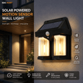 NHC MART solar powered motion sensor wall light in black, shown illuminated on a textured gray wall next to a modern house entrance. The image includes feature callouts and informational banners.