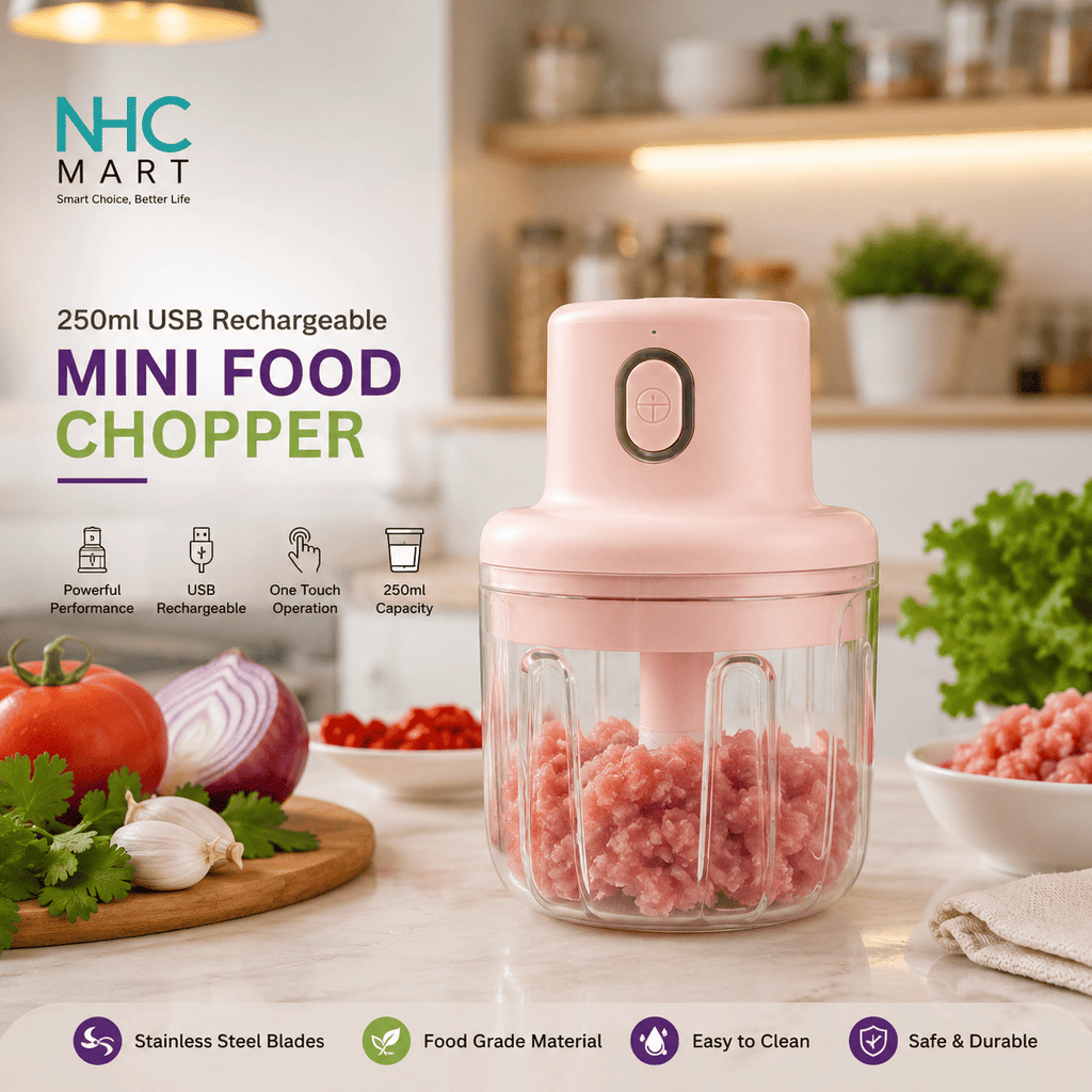 A pink mini food chopper with a clear jar filled with ground meat, shown on a kitchen countertop with tomatoes, onion, garlic, and herbs around it. The image includes marketing text and icons for features like USB rechargeability, one-touch operation, and food grade material.