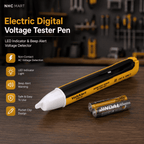 NHC MART Electric Digital Voltage Tester Pen in yellow and black with a white tip, shown alongside two Jindal AA batteries on a wooden workbench with a blurred workshop background.