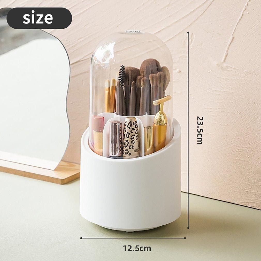 White cylindrical makeup organizer with brushes and a bottle, showing measurements on a neutral background.