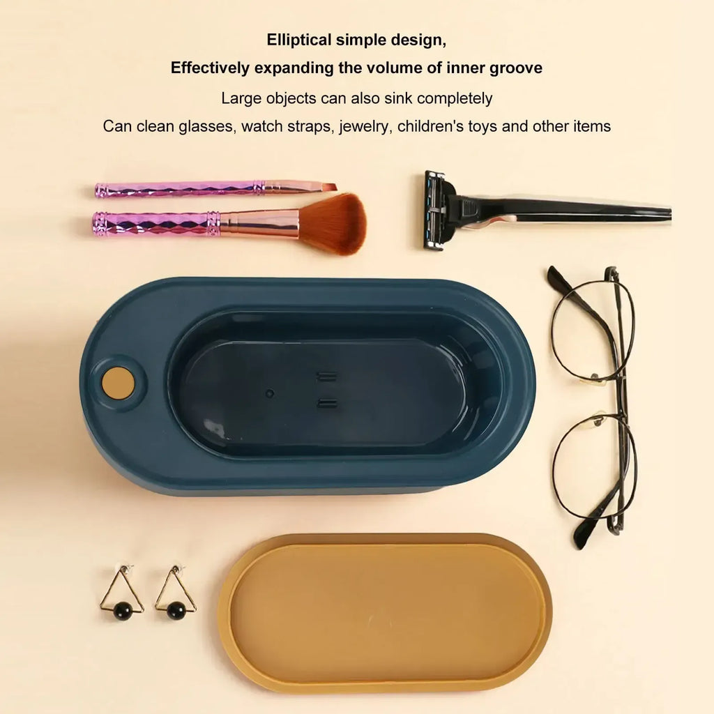 Two oval-shaped trays, one blue and one gold, with various items on a beige background.