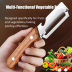 Multi-functional vegetable peeler held by a hand with fruits and vegetables in the background.