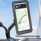 A black full-surround phone holder mounted on a handlebar, displaying a GPS map on a phone screen. The background shows a blurred blue sky and bridge structure, with text reading 'Full surround phone holder' and 'Suitable for various vehicle models'.