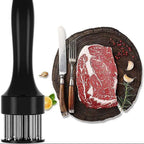 Meat tenderizer on the left with a steak on a wooden board with cutlery and spices on the right.