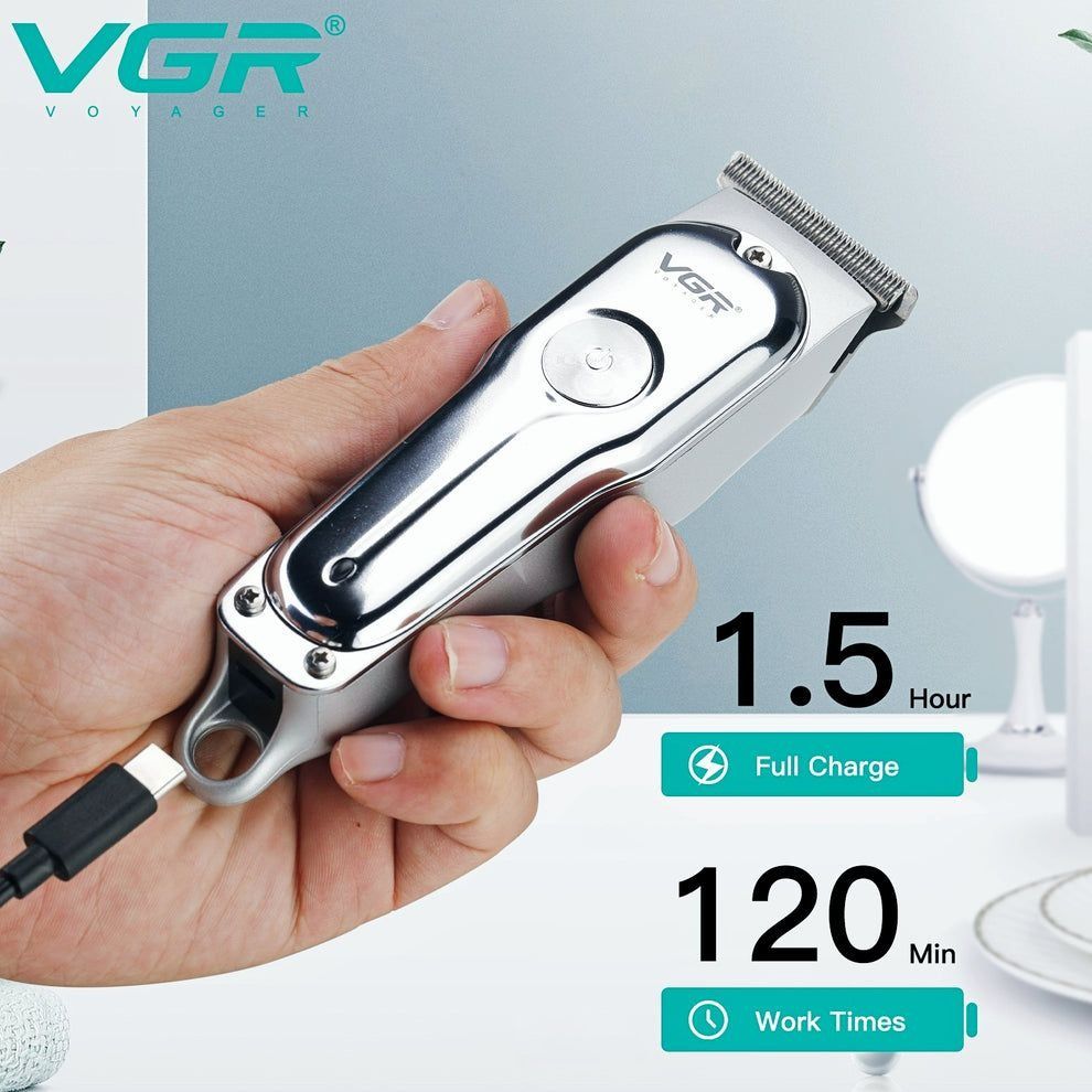Hair clipper held in a hand with charging cable, VGR brand visible